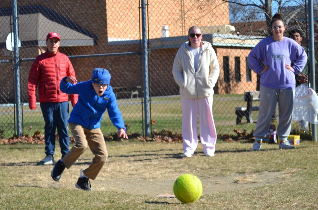 Adaptive Elliot kicking with joy